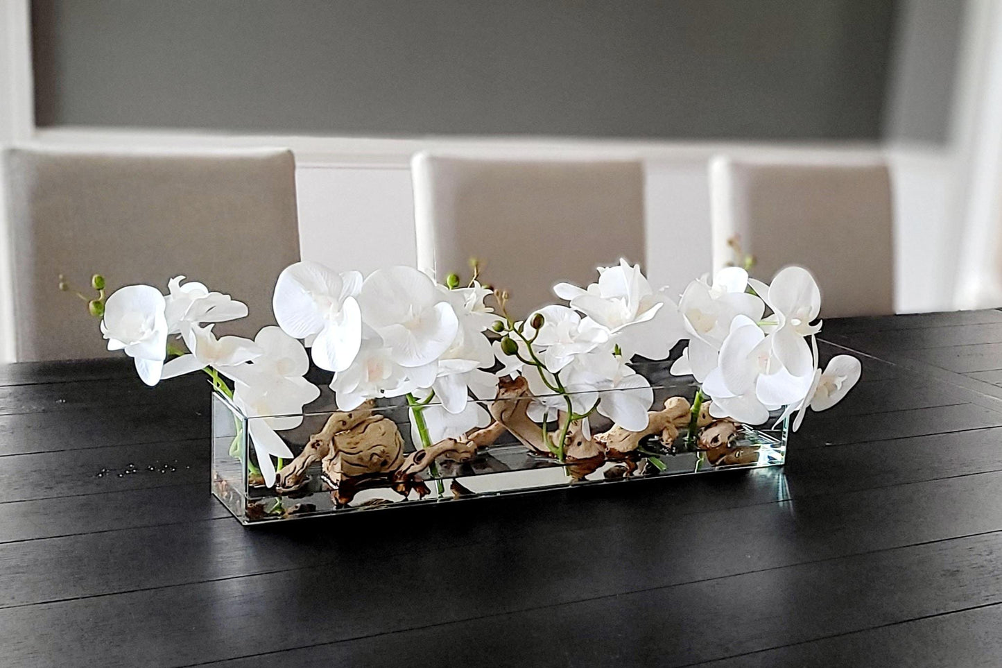 Versatile Orchid Centerpiece Silk Flower Arrangement Multiple Room Placement Elegant Glass Vase Driftwood Accents Maintenance Free Display Realistic Floral Design Home Decoration Piece Dining Table Accent Entryway Statement Piece Artificial