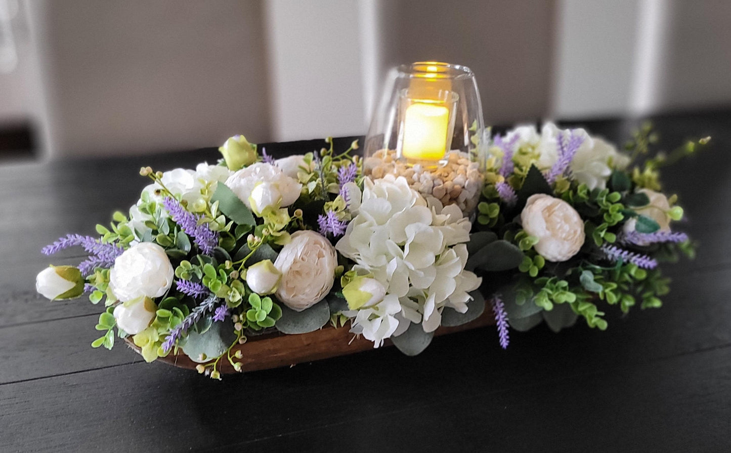 Faux Flower Centerpiece Spring Table Arrangement Peony Hydrangea Lavender Collection Wooden Dough Bowl Design Elegant Dining Display Glass Hurricane Candle Feature Rustic Home Accent Handcrafted Floral Creation Spring Celebration Decoration