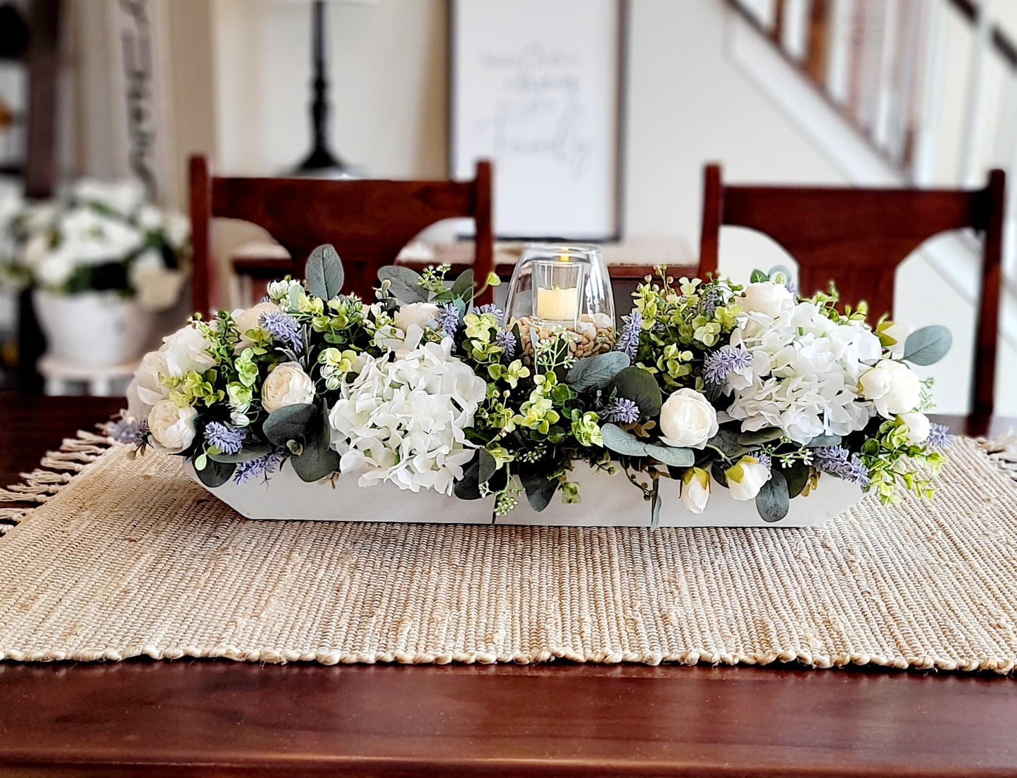 Rustic Farmhouse Centerpiece Wooden Dough Bowl Display Spring Floral Arrangement Faux Peony Hydrangea Lavender Collection Handcrafted Table Decoration Elegant Home Accent Glass Hurricane Candle Feature Seasonal Dining Display Perfect Spring