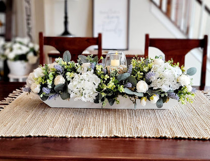 Rustic Farmhouse Centerpiece Wooden Dough Bowl Display Spring Floral Arrangement Faux Peony Hydrangea Lavender Collection Handcrafted Table Decoration Elegant Home Accent Glass Hurricane Candle Feature Seasonal Dining Display Perfect Spring