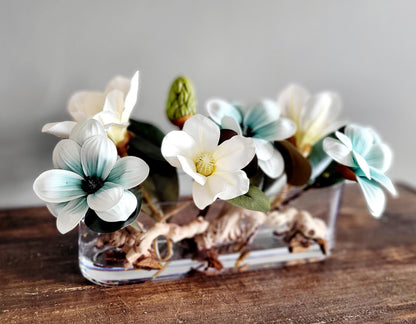 Dining Table Centerpiece – Blue Magnolia Arrangement in Long Glass Vase