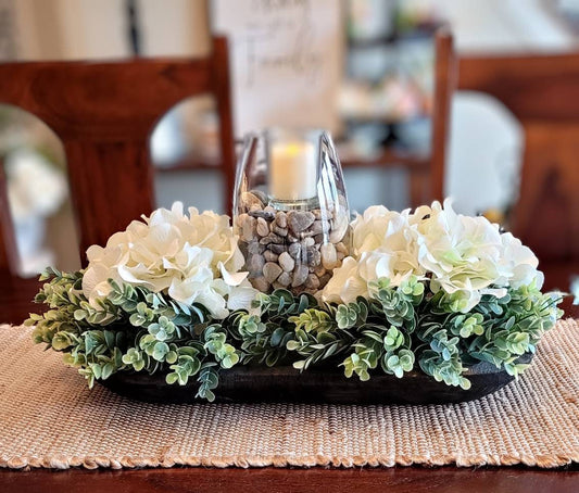 Farmhouse Table Centerpiece Black Dough Bowl Arrangement White Hydrangea Flowers Votive Candle Display Glass Vase Accent Rustic Wooden Design Earth Tone Rocks Elegant Dining Table Decor Seventeen Inch Length Ready Display Stylish Home