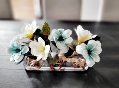Modern Floral Centerpiece Blue Magnolia Display Long Glass Vase Arrangement Artificial Flower Collection Elegant Dining Table Decor Contemporary Home Accent Realistic Faux Blooms Maintenance Free Design Stylish Interior Addition Premium