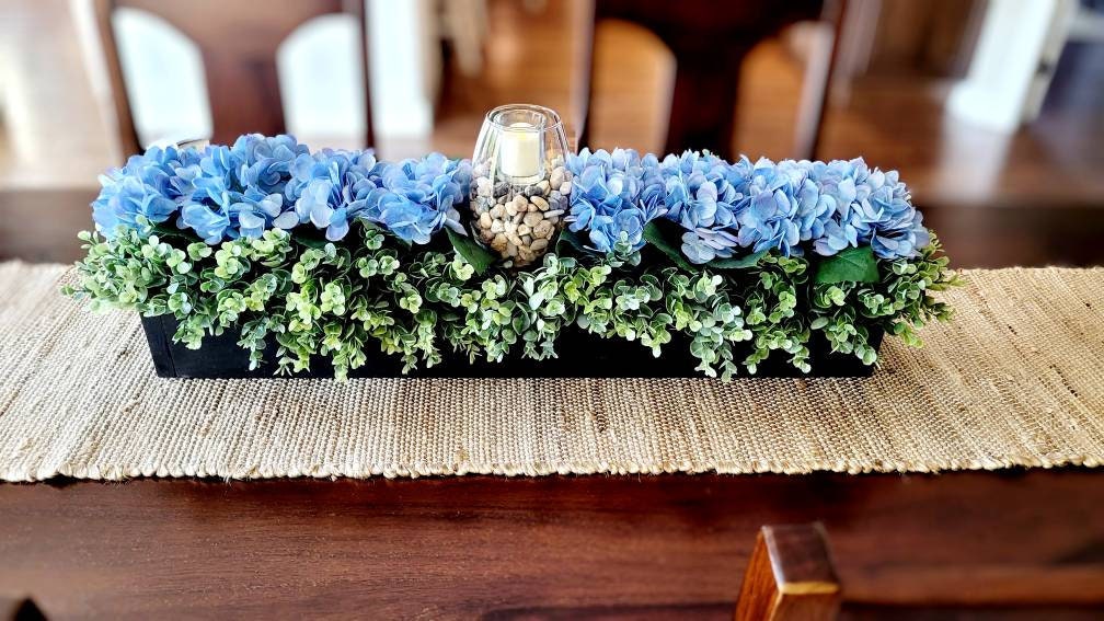 Blue Hydrangea Arrangement Wooden Box Centerpiece Farmhouse Style Decor Rustic Table Decoration Floral Display Piece Handcrafted Wood Container Natural Finish Design Lush Green Accents Beautiful Dining Table Accent Country Home Style
