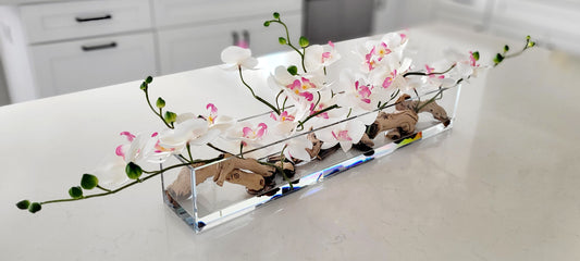 Artificial Orchid Arrangement Pink Silk Flowers Glass Vase Centerpiece Modern Home Styling Faux Orchid Display Realistic Flower Design Maintenance Free Pink White Blooms Driftwood Accent Elegant Table Centerpiece Living Room Enhancement