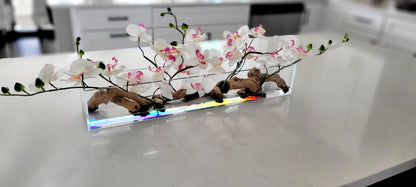 Faux Orchid Centerpiece Glass Vase Display Artificial Pink Flowers Silk Orchid Arrangement Modern Home Styling Maintenance Free Flower Centerpiece Realistic Blooms Pink White Design Elegant Table Enhancement Living Room Focal Point