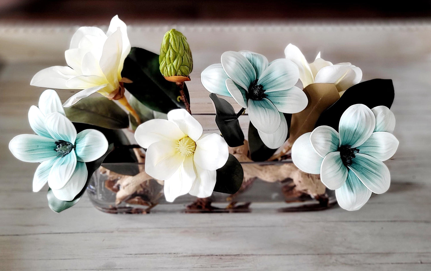 Dining Table Centerpiece – Blue Magnolia Arrangement in Long Glass Vase