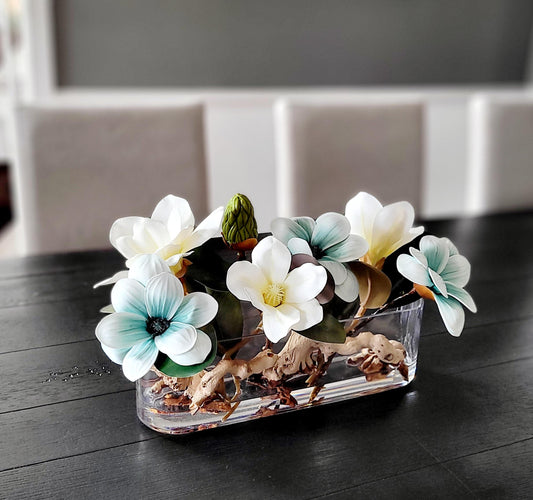 Dining Table Centerpiece Blue Magnolia Arrangement Long Glass Vase Modern Floral Display Elegant Home Decor Faux Flower Collection Realistic Artificial Blooms Maintenance Free Beauty Permanent Table Decoration Contemporary Design Accent