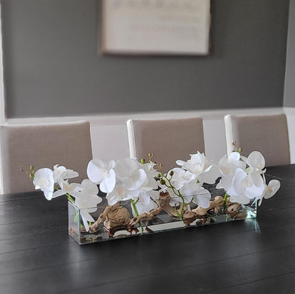 Elegant Glass Vase Orchid Arrangement Silk Flowers Driftwood Accents Maintenance Free Centerpiece Realistic Floral Design Dining Table Decoration Home Decor Accent Sophisticated Interior Style Artificial Orchids Faux Water Display Natural
