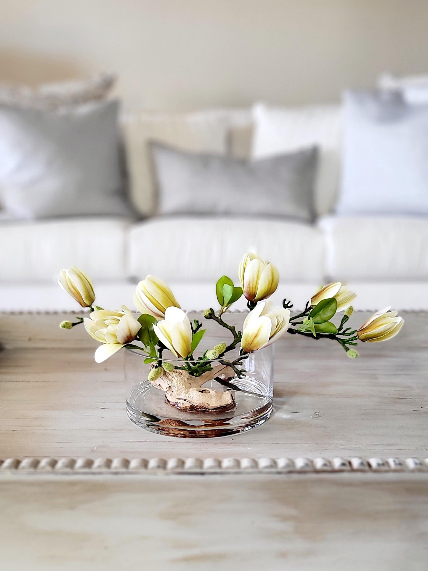 Realistic Faux Orchid Display Silk Flower Arrangement Glass Vase Centerpiece Elegant Dining Table Styling Modern Artificial Orchid Collection Driftwood Accent Details Maintenance Free Home Display Contemporary Living Room Focal Point