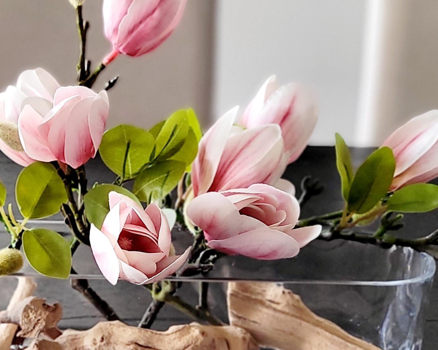 Realistic Silk Orchid Arrangement Elegant Glass Vase Display Modern Floral Centerpiece Faux Water Illusion Sophisticated Table Decor Artificial Flower Collection Botanical Home Accent Premium Quality Construction Driftwood Elements