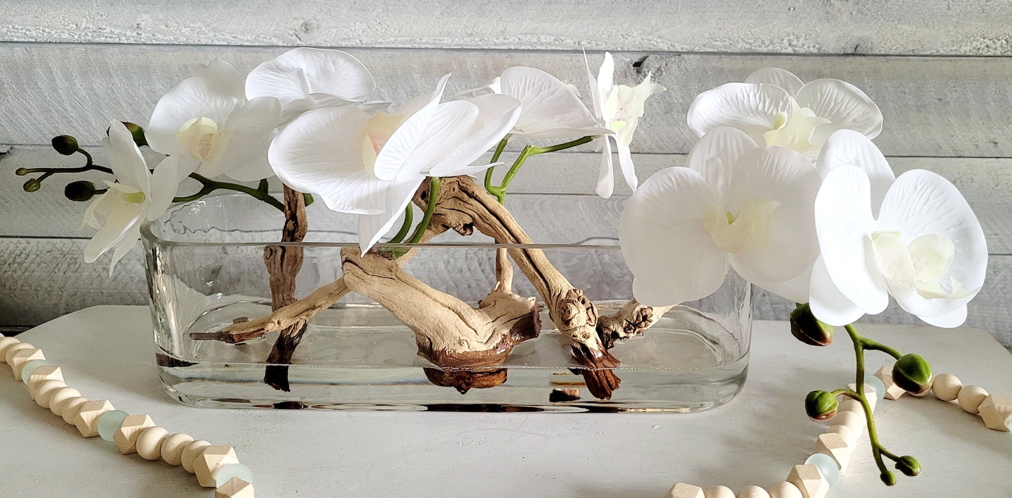 Modern Orchid with Drift Wood Centerpiece in Long Glass Vase