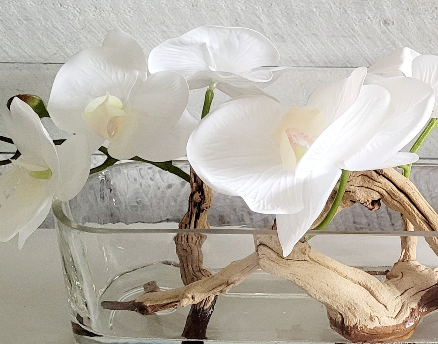 Modern Orchid with Drift Wood Centerpiece in Long Glass Vase