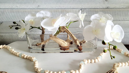 Modern Orchid with Drift Wood Centerpiece in Long Glass Vase