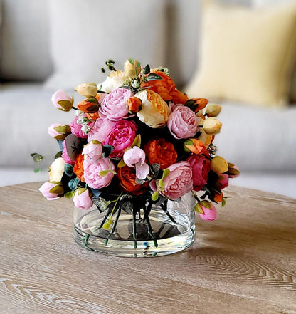 Realistic Artificial Flower Arrangement Silk Peony Centerpiece Glass Vase Collection Faux Floral Display No Water Needed Maintenance Free Home Styling Colorful Ranunculus Blooms Pink Orange Yellow Tones Perfect Dining Table Centerpiece