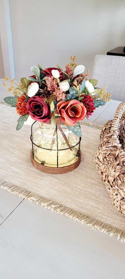 Autumn Lantern Centerpiece Rustic Fall Wedding Display Lighted Glass Vase Arrangement Burgundy Artificial Roses Cream Silk Flowers Battery Powered Fairy Lights Vintage Farmhouse Table Styling Wooden Base Design Seasonal Home Celebration