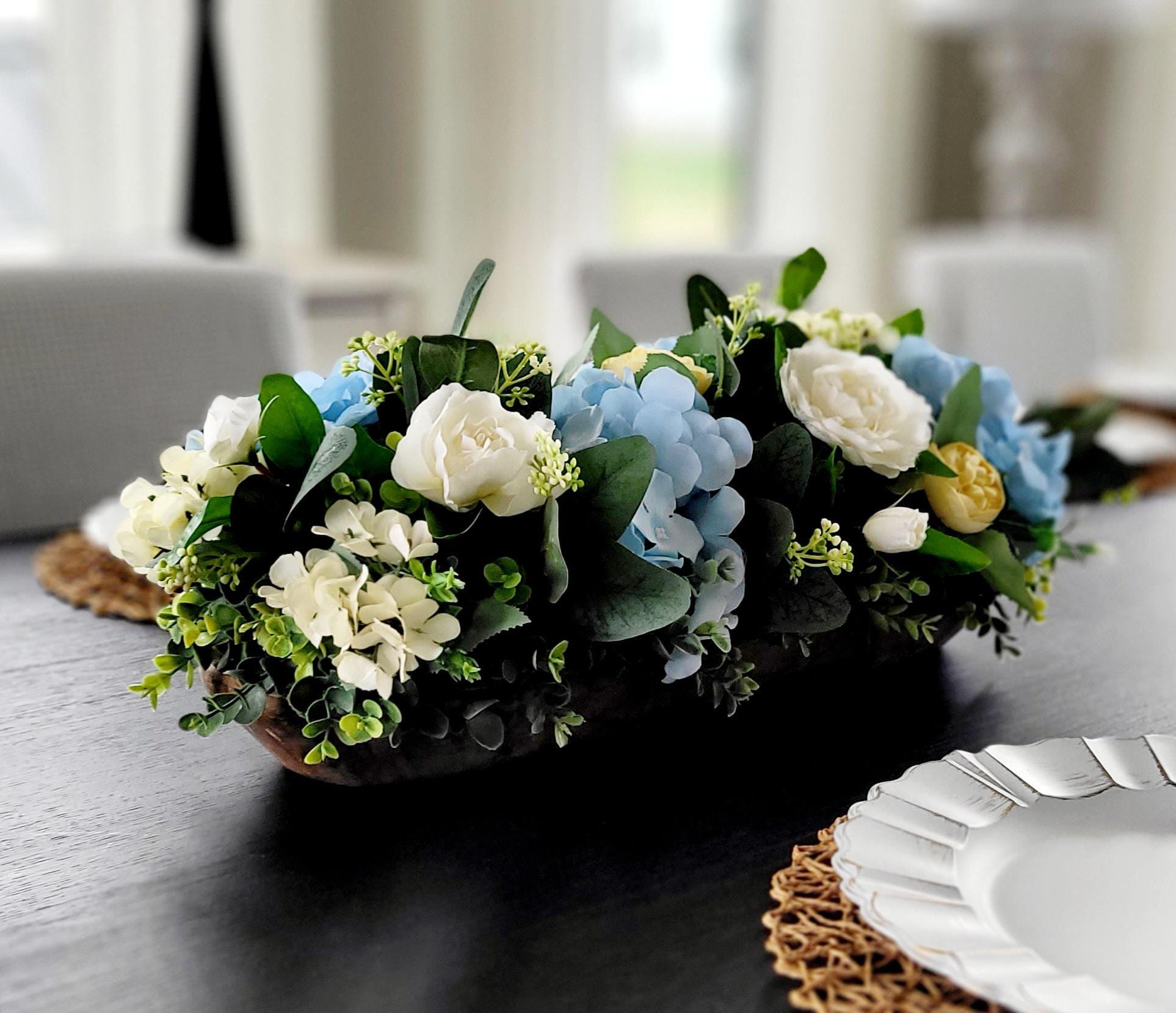 Rustic Wedding Centerpiece Wood Slice Floral Arrangement Cream Roses Blue Hydrangeas Yellow Ranunculus Artificial Flower Display Farmhouse Style Dining Table Centerpiece Country Home Styling Perfect Reception Table Display Maintenance Free