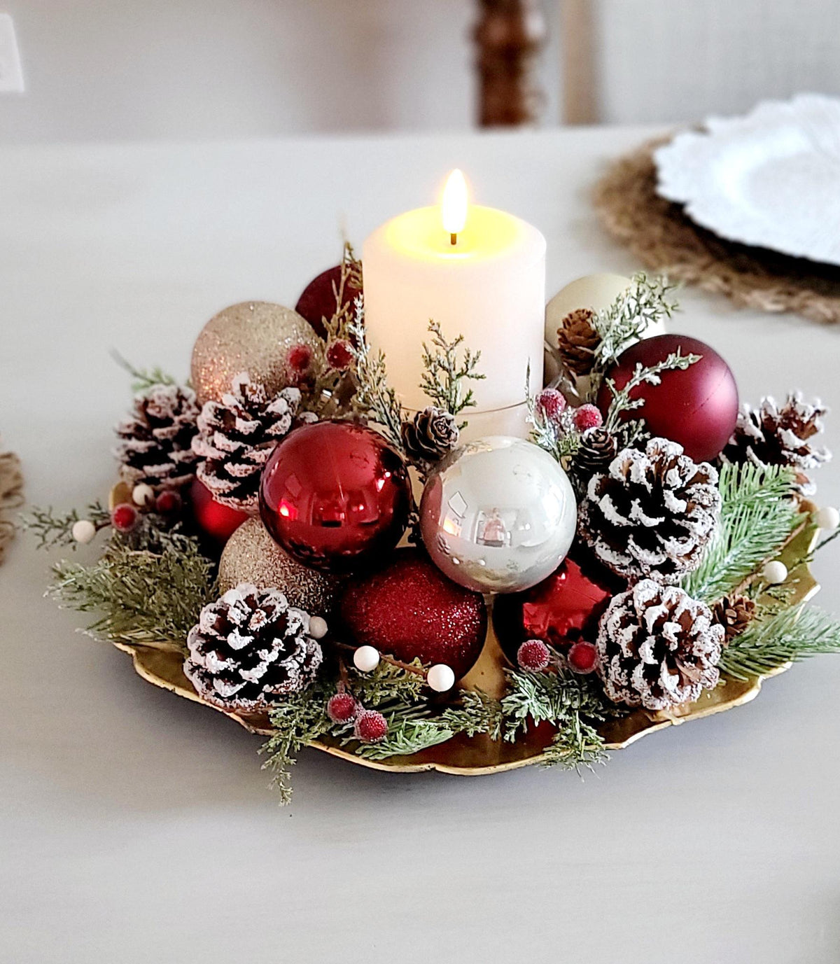 Farmhouse Christmas Centerpiece Rustic Holiday Table Styling Red Gold White Ornament Balls Festive Candle Holder Arrangement Frosted Pinecones Evergreen Sprigs Winter Seasonal Dining Table Styling Coffee Table Mantel Display Ready Made