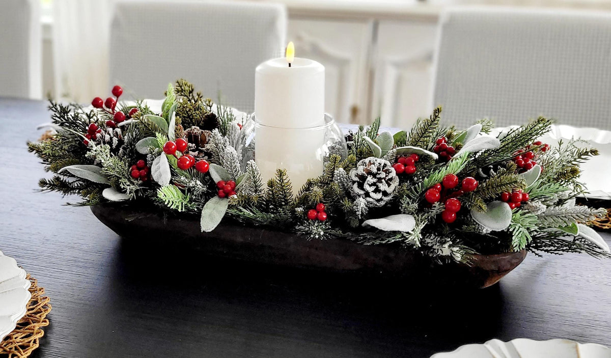 Winter Table Arrangement Handcrafted Christmas Centerpiece Rustic Wooden Dough Bowl Farmhouse Holiday Styling Pine Branches Frosted Pinecones Red Berry Accents Snow Dusted Greenery Glass Candle Holder Perfect Dining Display Mantel Styling