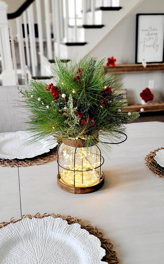 Farmhouse Christmas Centerpiece Lighted Lantern Display Rustic Holiday Table Arrangement Winter Pine Berry Accents Warm Glowing String Lights Indoor Seasonal Home Styling Cozy Festive Ambiance Country Style Dining Room Mantel Console