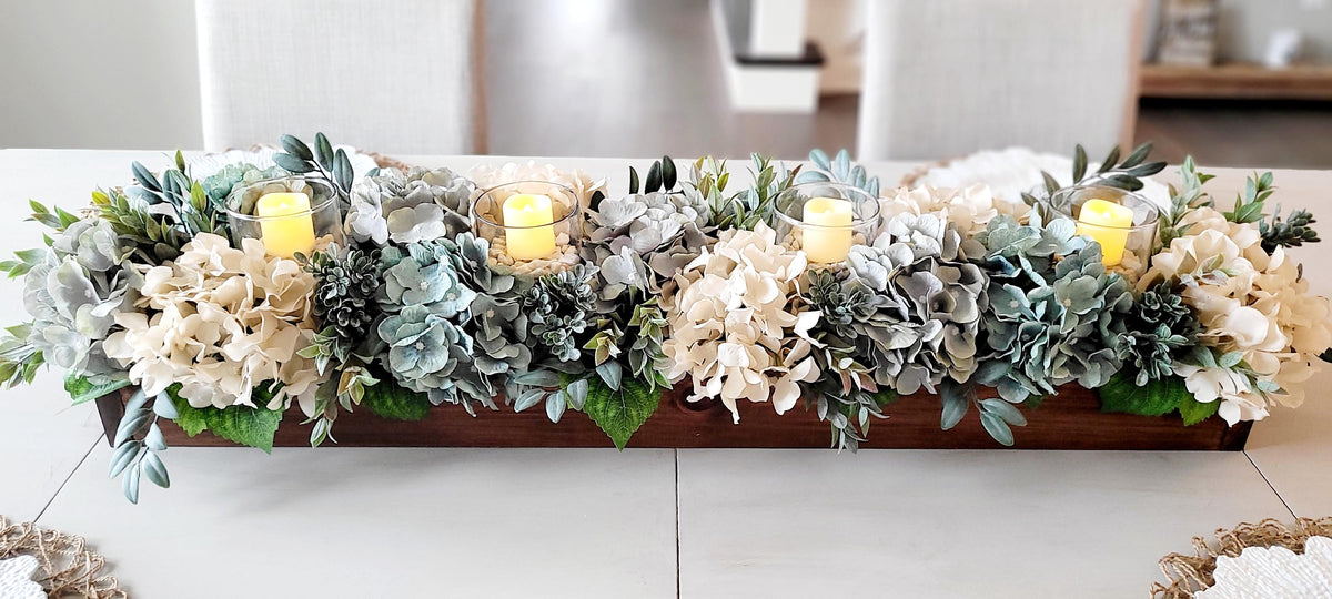 Dining Table Centerpiece Long Wood Box With Hydrangea Flowers Cream White Blue Gray Blooms Three Pillar Candles Rustic Farmhouse Style Arrangement Artificial Botanical Display Eucalyptus Lambs Ear Greenery Handcrafted Quality Design Perfect