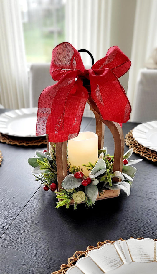 Christmas Lantern Centerpiece Rustic Wooden Frame Design Farmhouse Holiday Table Setting Flameless LED Candle Light Battery Operated Safety Feature Red Berry Accents Pine Greenery Arrangement Festive Ribbon Bow Handle Winter Home Gift