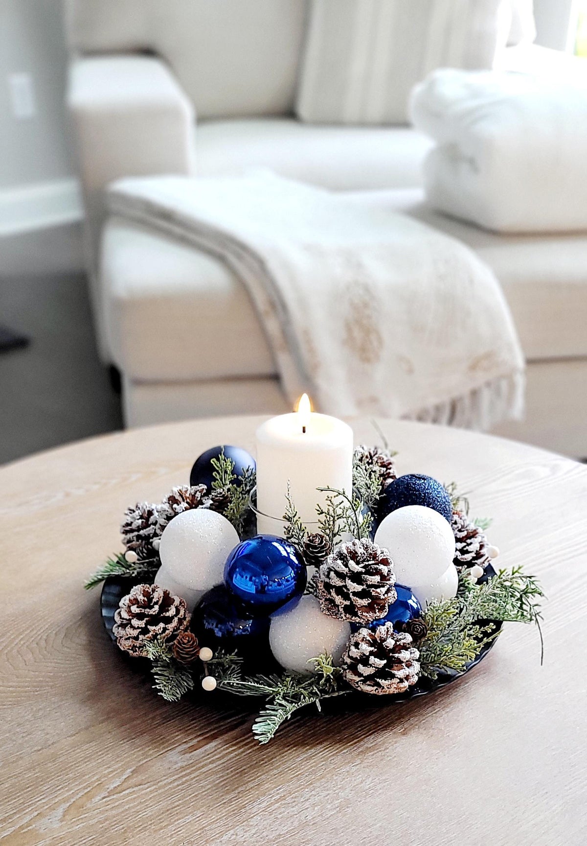 Farmhouse Christmas Centerpiece Rustic Holiday Table Display Handcrafted Candle Arrangement Winter Dining Focal Point Festive Red Ornaments Natural Pine Greenery Seasonal Pinecone Collection Traditional Styling Modern Christmas Table