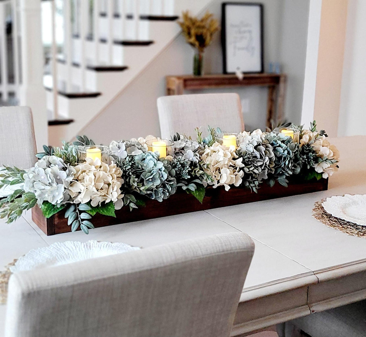 Rustic Wooden Box Centerpiece With Artificial Hydrangea Arrangement Blue Cream White Flowers And Greenery Eucalyptus Lambs Ear Foliage Three LED Candles Integrated Design Perfect Dining Table Display Everyday Home Styling Neutral Color
