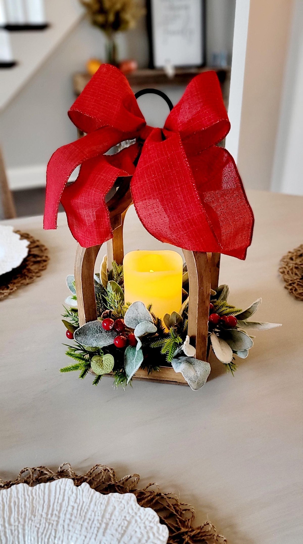 Rustic Holiday Centerpiece Wooden Lantern Frame Farmhouse Christmas Table Setting Battery Operated Flameless Candle Safe LED Light Source Red Berry Pine Greenery Collection Festive Bow Accent Arched Handle Design Winter Mantel Display