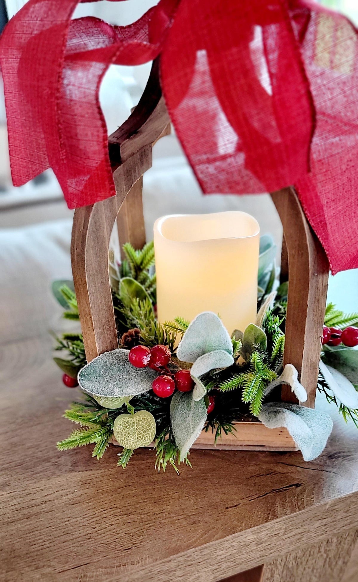 Wooden Christmas Lantern Rustic Farmhouse Centerpiece Holiday Table Display Battery Operated LED Candle Flameless Safe Lighting Red Ribbon Bow Accent Pine Berry Greenery Arrangement Winter Home Gift Seasonal Mantel Styling Dining Room Table