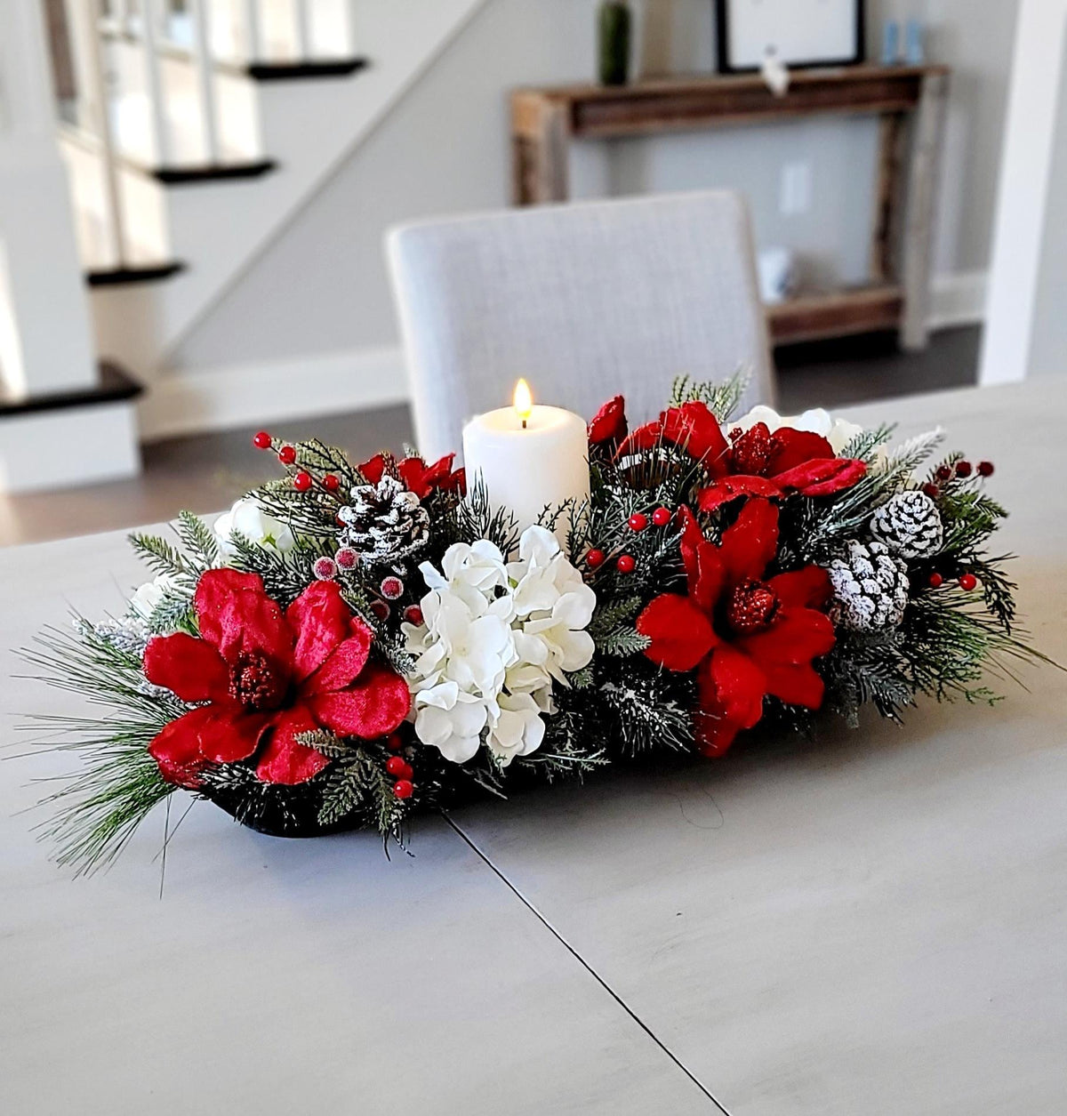 Farmhouse Christmas Candle Centerpiece Wooden Dough Bowl Display Red Poinsettia Winter Floral Arrangement White Blooms Pine Greenery Snow Dusted Pinecones Berry Accents Holiday Table Dining Room Seasonal Mantel Kitchen Console Rustic