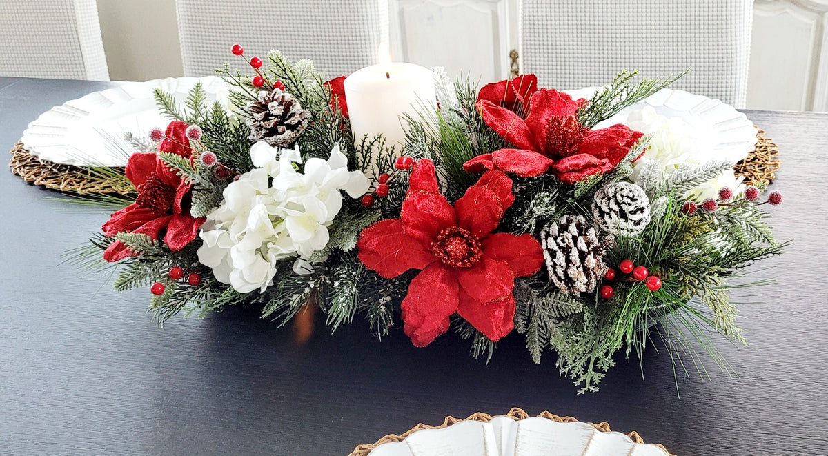 Rustic Christmas Dining Table Centerpiece Farmhouse Wooden Dough Bowl Candle Display Red Poinsettia Floral Arrangement White Blooms Evergreen Pine Branches Berry Accents Snow Dusted Pinecones Holiday Mantel Kitchen Console Seasonal Winter